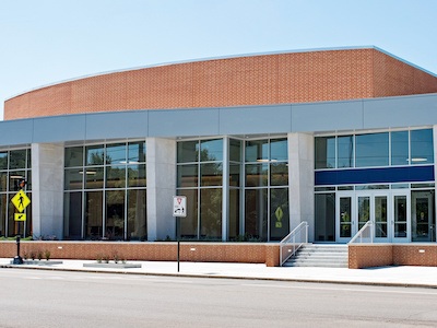 Entrance of school needing PPE equipment and COVID-19 signs