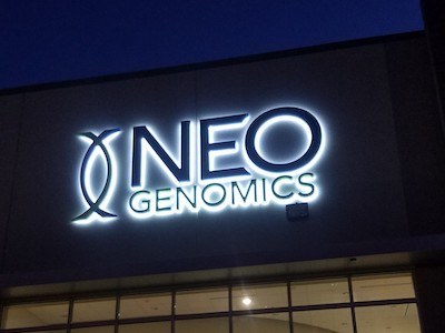 NeoGenomics outdoor channel sign light up at night after installation by Houston sign company National Signs