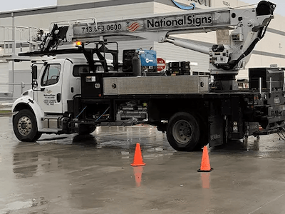 National Signs truck providing sign services to help customer repair signage in Houston, Texas