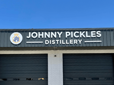 Channel letter signage for Johnny Pickles Distillery in Seguin, Texas designed, fabricated, and installed by National Signs.