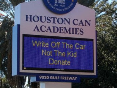 Digital sign for Houston Can Academies reading “WRITE OFF THE CAR NOT THE KID.”