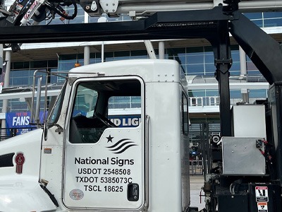 National Signs repair truck onsite at a signage repair service.