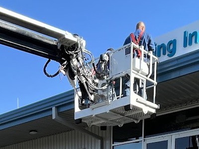 National Signs crew repairing building signage